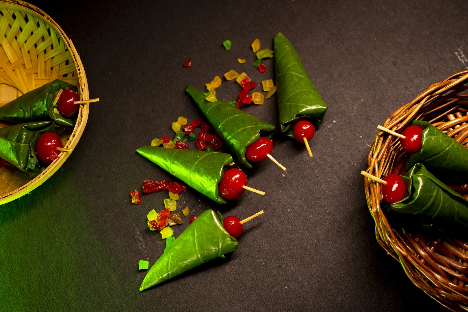 Platter of artisanal Banarasi paan handcrafted with cherries and betel leaves
